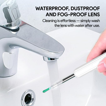 Nuwelo Clear Ear Wax Removal tool being washed under water featuring text about waterproof, dustproof, and fog-proof lens cleaning.