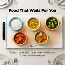 Slursh food warming tray with various dishes on a white surface