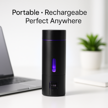 Black portable hydrogen water bottle with purple light indicator on a desk next to a laptop, with text 'Portable • Rechargeable • Perfect Anywhere'.