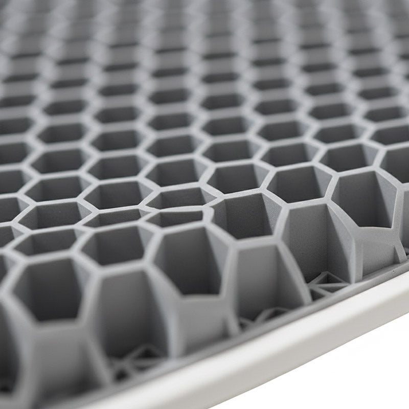 Close up of a honeycomb-like grid structure with hexagonal cells of Nuwelo Posture Max Pro
